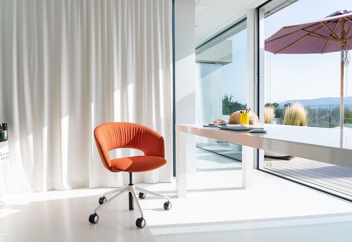 Chair Calina with white 5-prong base and orange upholstery