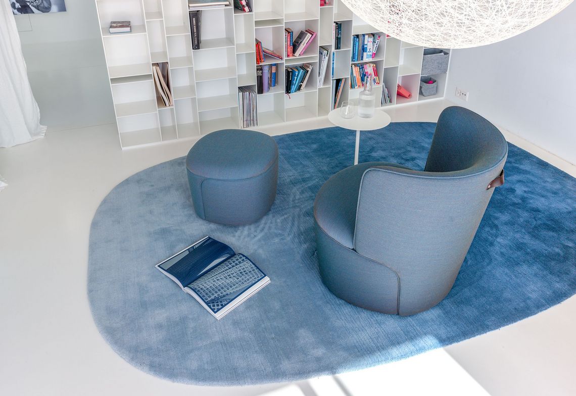 Armchair and stool Cina at home